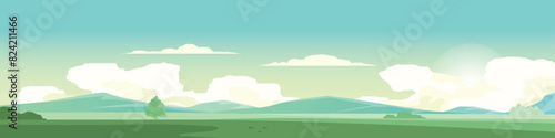 Landscape view of nature green meadow. Complex hills with a mountain background. Under warm sky and clouds.