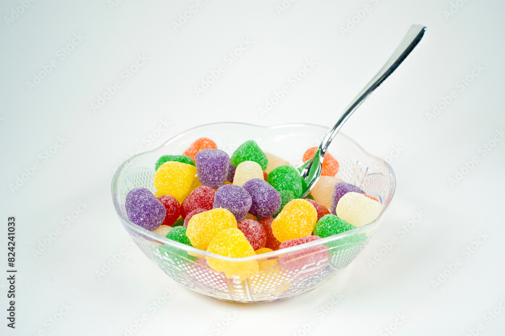 Colorful Gum Drops Candy In A Glass Bowl & Spoon With A White Background Colorful Gum Drops Candy In A Glass Bowl & Spoon With A White Background