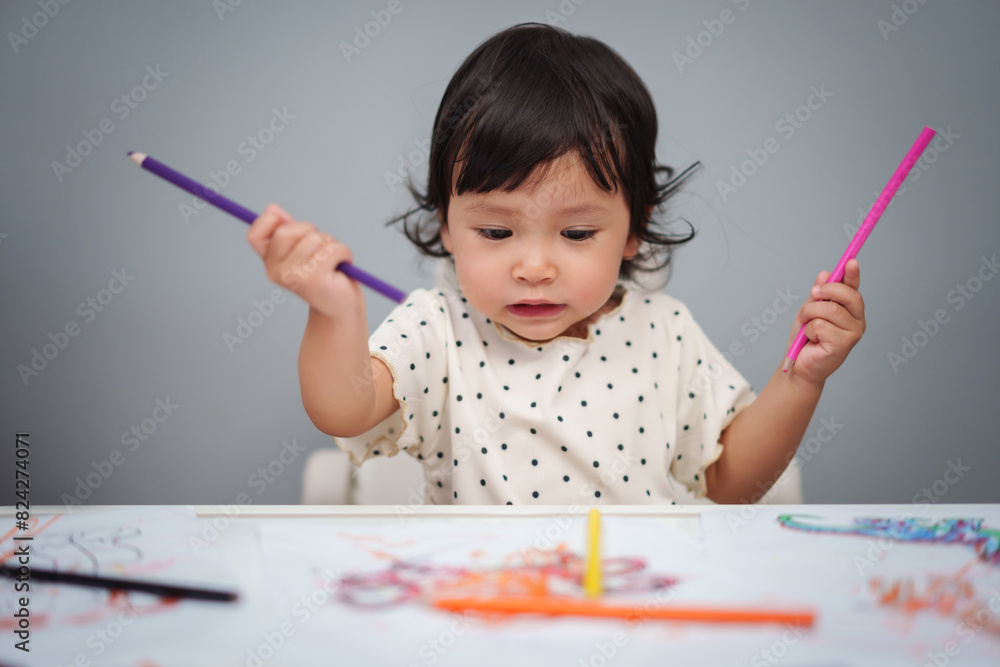 toddler baby playing and training to drawing with colored pencil on table toddler baby playing and training to drawing with colored pencil on table