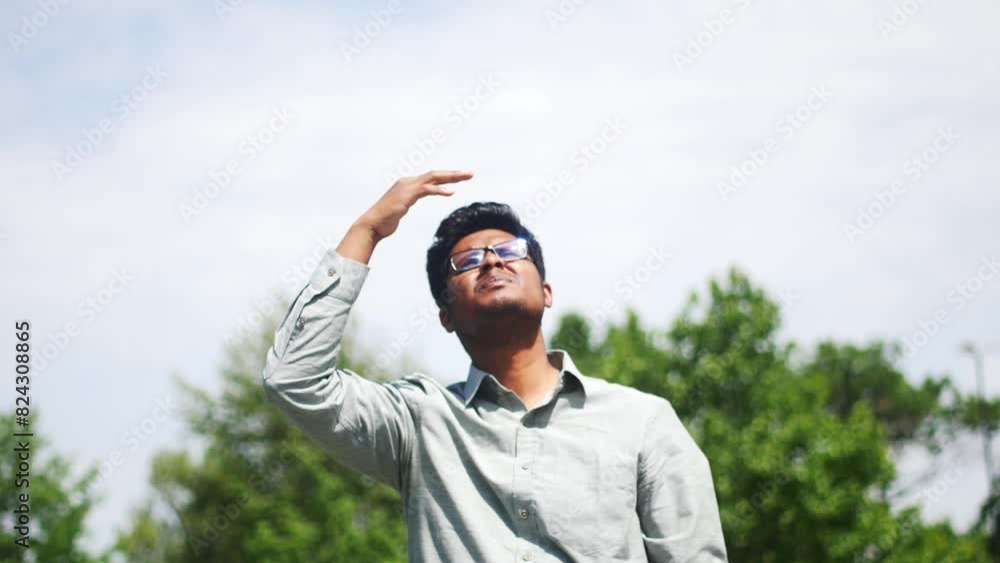 young man covering her face to block sun light. young man covering her face to block sun light.