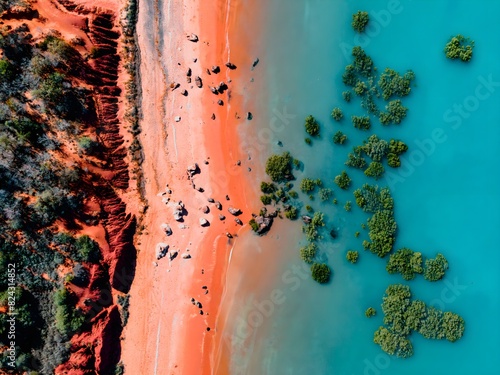 Aerial View of Pink Sandy Beach and Turquoise Blue Water with Green Mangroves and Rocks