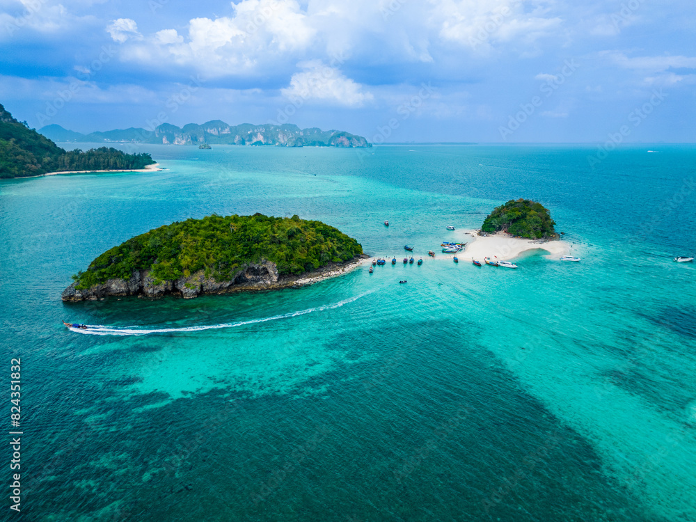 Fototapeta premium Chicken Island and Tub Island in Thailand. Top aerial drone view of a paradise beach, ocean, white sand, mountains, cliffs, and boats