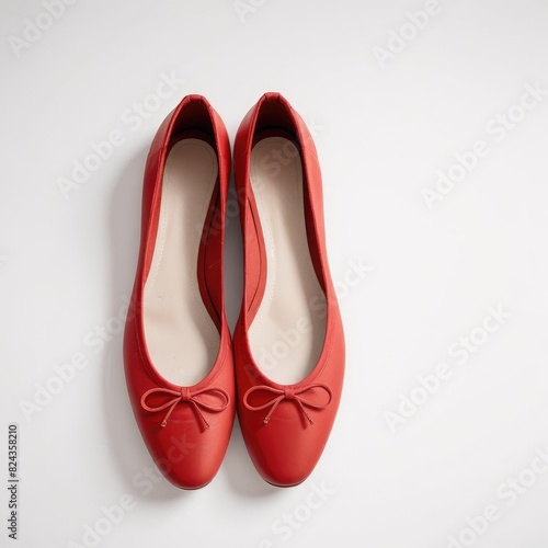 a clean white background, red ballet flats exude a vibrant elegance, adding a pop of color to the scene