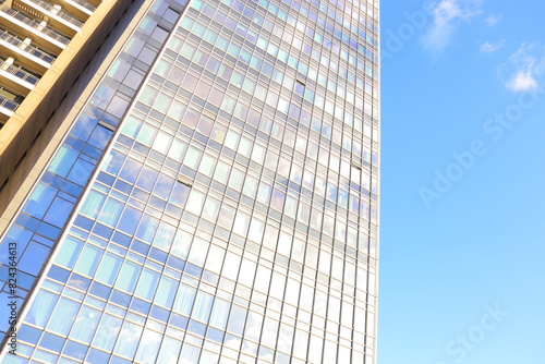 facade of a building, angled view, blue sky, for desktop, business presentation background