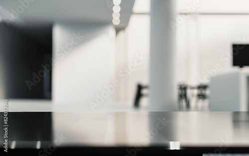 Elegant Modern Office with Sleek Black Glass Table and Blurred Background Featuring High-Tech Theme and Professional Women