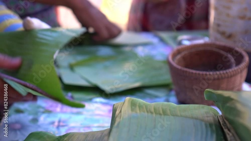 Grilling sticky rice sesame sesame local Shan Tai yai food Chiangmai Thailand Southeast Asia banana leaf eco friendly package photo