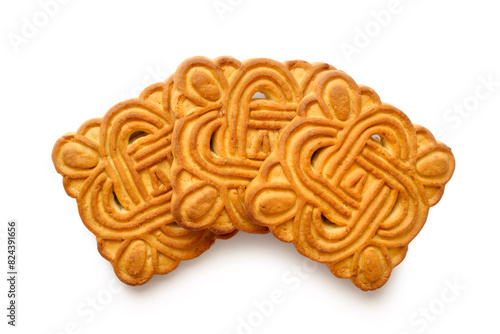 Three square cookies with patterns on a white background. Delicious cookies close-up.