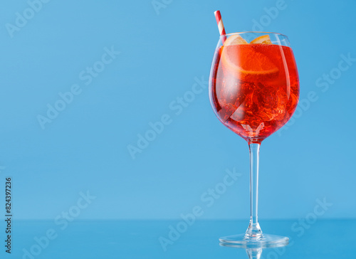 Aperol spritz cocktail with orange slice and ice