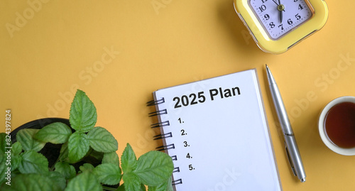 Note book with 2025 plans text. New year resolutions and plan.
