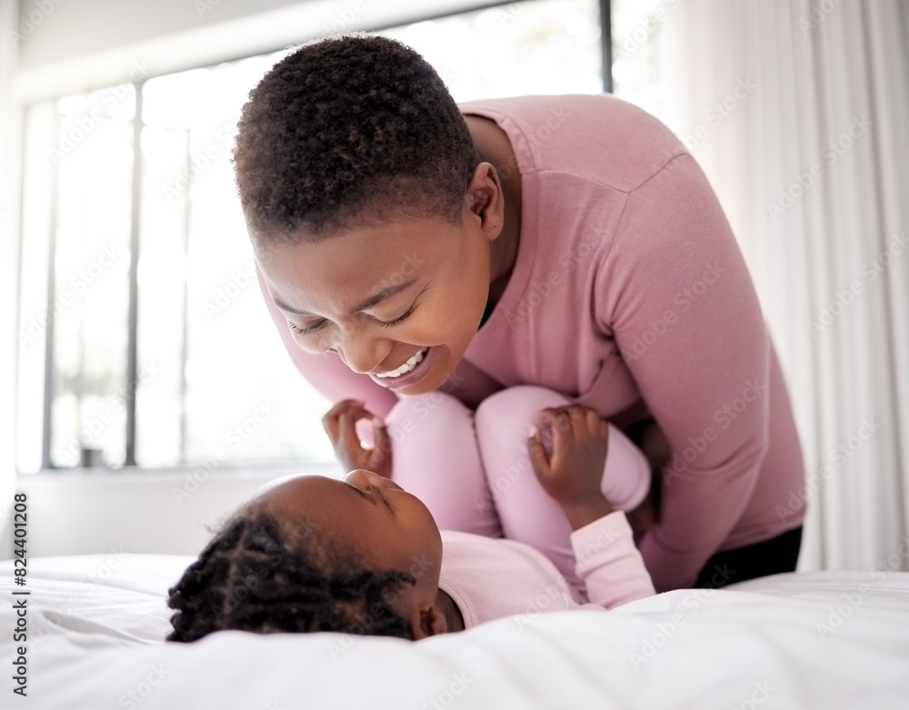 Bedroom, morning and mother playing with girl in bed of home together for bonding. Black family, kids and love with african woman, daughter and child fun together in house for waking up on weekend Bedroom, morning and mother playing with girl in bed of home together for bonding. Black family, kids and love with african woman, daughter and child fun together in house for waking up on weekend