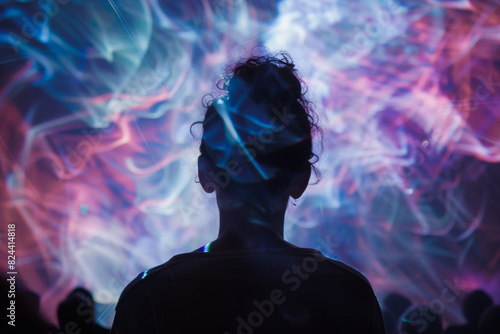 A silhouette of a beautiful woman standing and watching the concert stage, the crowd cheering in the background, colorful lights, bokeh effect,creating an atmosphere of dancing and having fun.