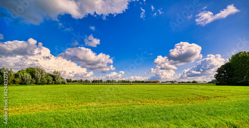 Grand cloudscape over a rustic landscape in The Netherlands. photo