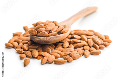 Peeled almond nuts in wooden scoop isolated on white background.