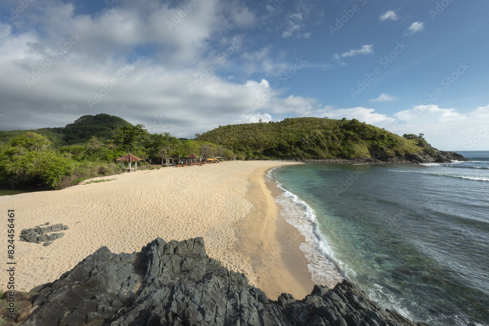 Mawi beach, white sand and a rocky coastline of Lombok island Mawi beach, white sand and a rocky coastline of Lombok island