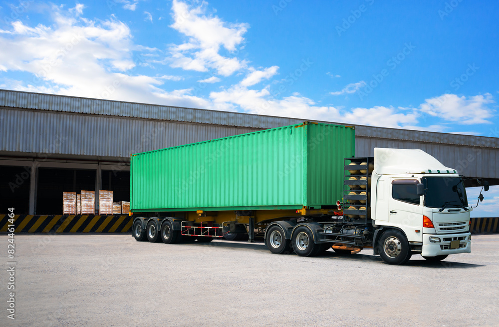 Semi Trailer Trucks on The Parking Lot at Warehouse. Truck Loading Goods at Warehouse. Container Shipping. Package Boxes Pallets. Trucking. Lorry Diesel Truck. Freight Truck Logistics Cargo Transport. Semi Trailer Trucks on The Parking Lot at Warehouse. Truck Loading Goods at Warehouse. Container Shipping. Package Boxes Pallets. Trucking. Lorry Diesel Truck. Freight Truck Logistics Cargo Transport.