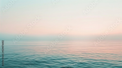 Serene Pastel Sunrise Over Tranquil Ocean Waters with Gentle Waves
