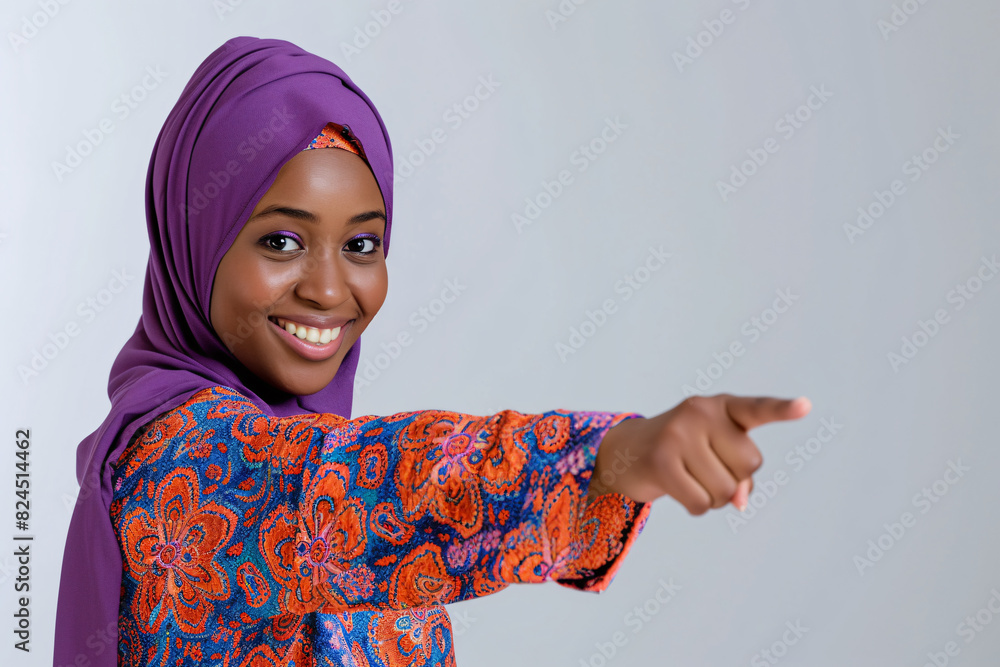 a woman wearing a purple head wrap pointing at the camera a woman wearing a purple head wrap pointing at the camera