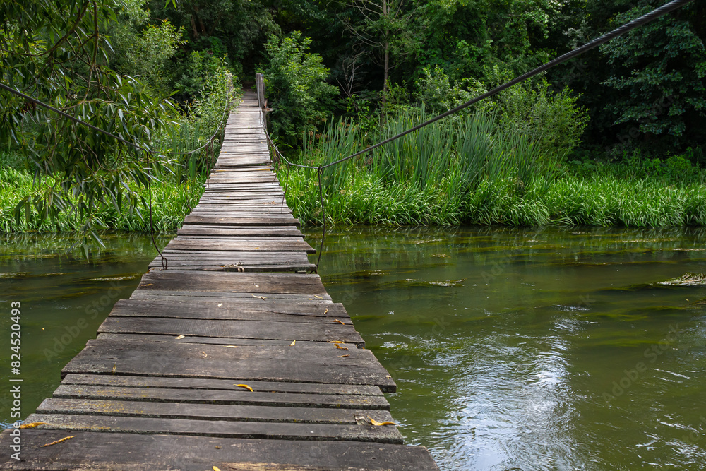 Fototapeta premium Suspension bridge, walkway to the adventurous, cross to the other side