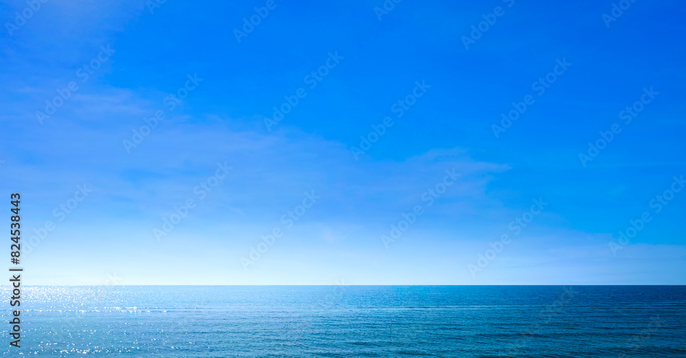 Ocean sea background and the clear sky For summer vacation ideas Nature of summer sea water with sunlight The sea sparkles against the blue sky Ocean sea background and the clear sky For summer vacation ideas Nature of summer sea water with sunlight The sea sparkles against the blue sky