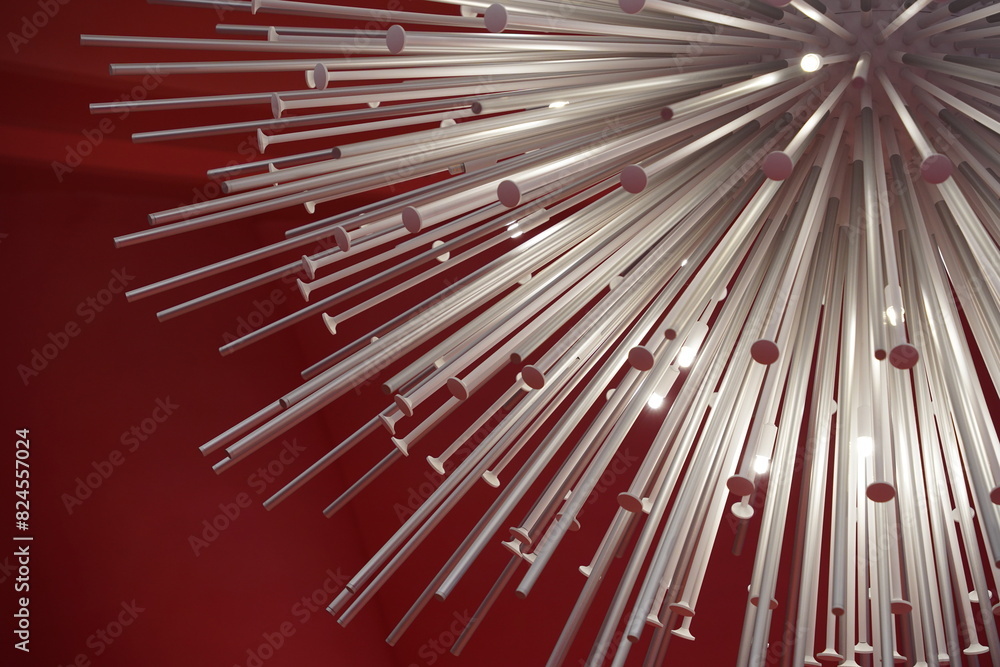 photo of a group of white metal rods on a red background photo of a group of white metal rods on a red background