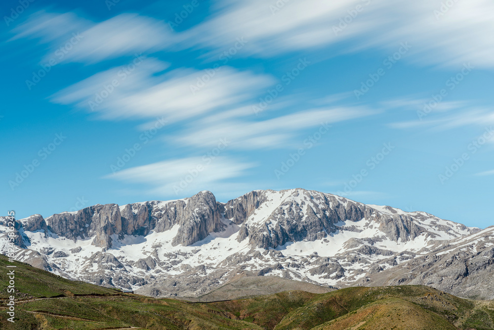 The lush green Sobucimen plateau in spring and the mountains with some melted snow behind. The lush green Sobucimen plateau in spring and the mountains with some melted snow behind.
