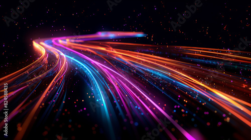a close up of a colorful light trail with blurry lights