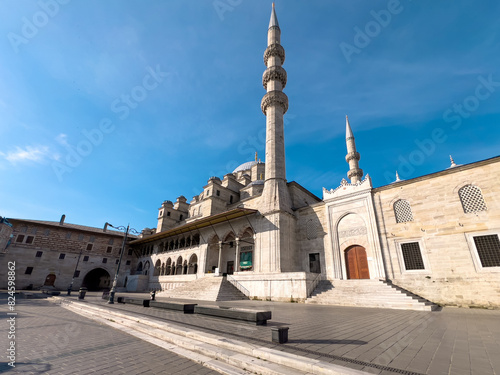Yeni Cami (New Mosque) located in Eminönü, Istanbul on a sunny spring day photo