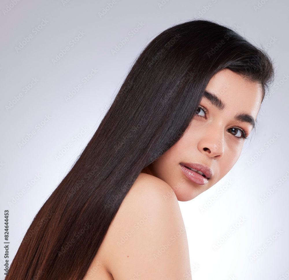 Confident, portrait and woman with hair care in studio for shampoo growth, satisfaction and pride. Serious, female person and hairstyle on white background for salon treatment, shine and wellness Confident, portrait and woman with hair care in studio for shampoo growth, satisfaction and pride. Serious, female person and hairstyle on white background for salon treatment, shine and wellness