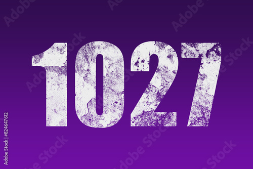flat white grunge number of 1027 on purple background. 