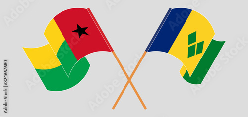 Crossed and waving flags of Guinea-Bissau and Saint Vincent and the Grenadines photo