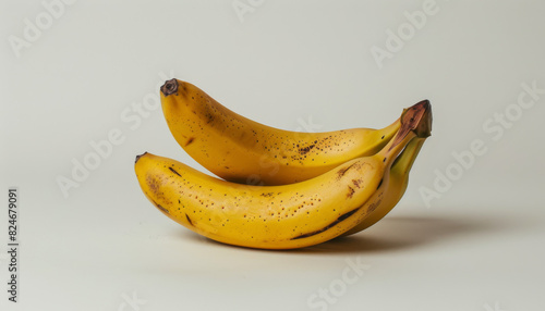 Three bananas are sitting on a white background