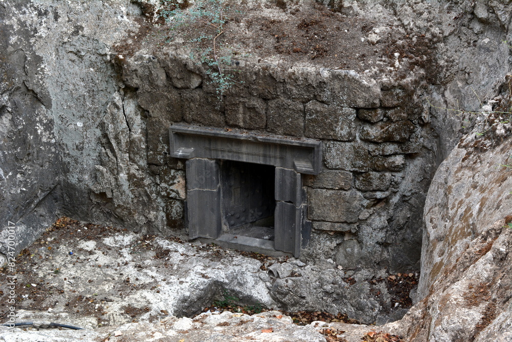Entrance to an ancient Jewish funerary cave at Beit Shearim in Israel. Entrance to an ancient Jewish funerary cave at Beit Shearim in Israel.