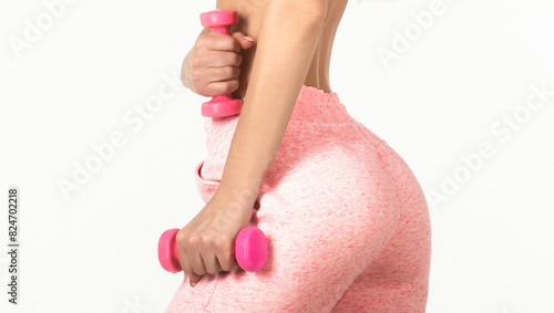 Woman with dumbbell fit slim abs body. Muscular woman workout with dumbbells photo