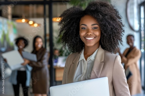 Business African: Beautiful Smiling African Businesswoman with Laptop Leading Meeting