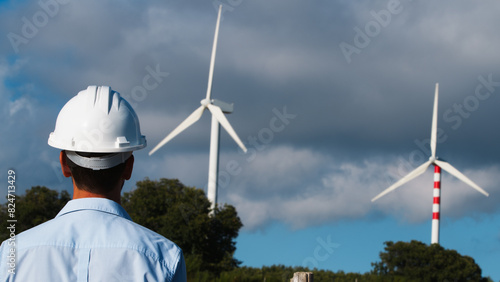 Engineer Taking A Look At The Wind Turbines 