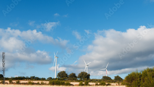 Wind Turbines Surrounded By Blue Sky 