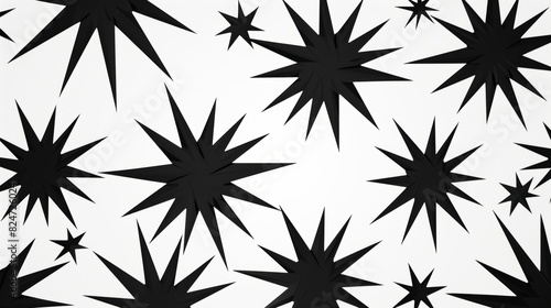 An arranged pattern of black starburst shapes on a white background creates a geometric monochromatic design.