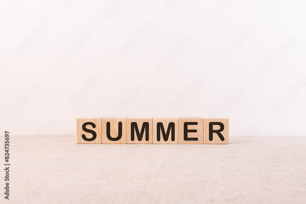 The word Summer on wooden cubes. Concept Seasons of year. The word Summer on wooden cubes. Concept Seasons of year.