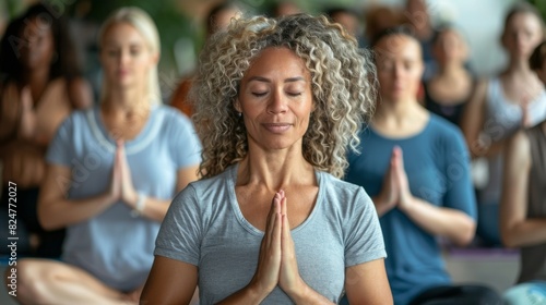 Group of people in yoga class meditating