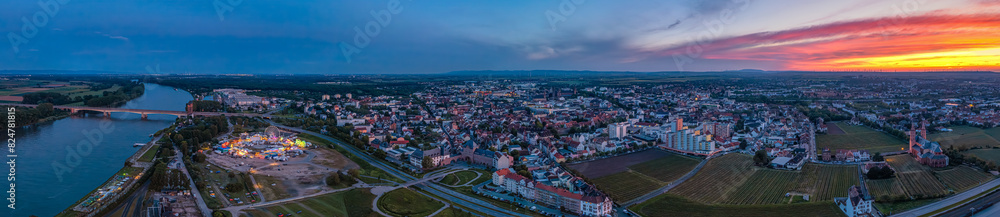 Fototapeta premium worms germany and rhine river pfigstmarkt folk festival 2024 evening earial