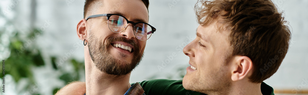Two men, a gay couple, stand closely united as they work together in a designer workshop creating trendy attire. Two men, a gay couple, stand closely united as they work together in a designer workshop creating trendy attire.