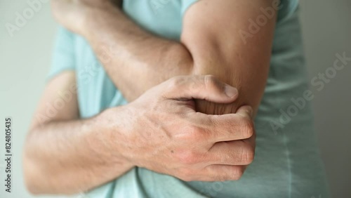 Tennis elbow, clinically known as lateral epicondylitis. is medical condition that causes pain around the elbow. photo