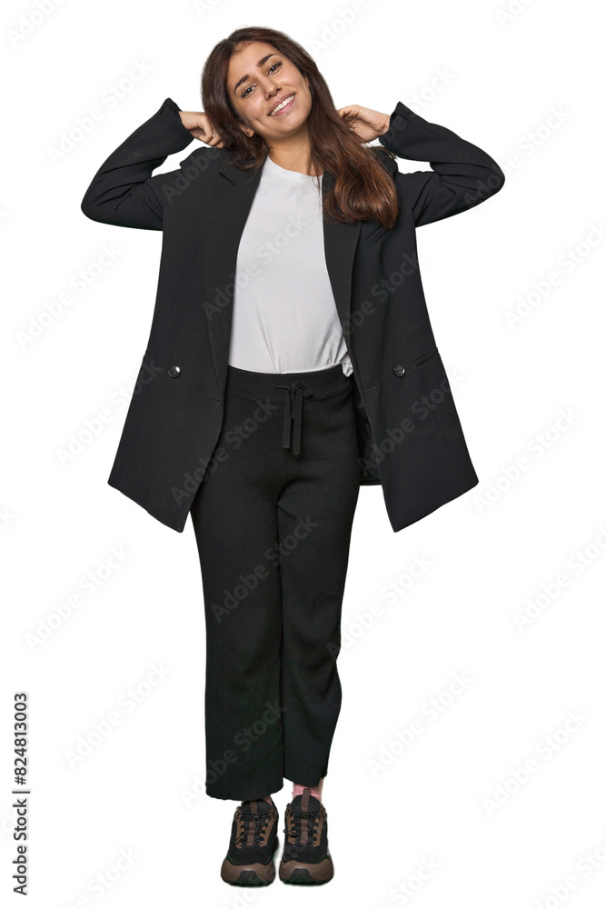 Middle Eastern in business attire stretching arms, relaxed position. Middle Eastern in business attire stretching arms, relaxed position.