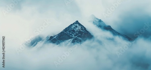 mountain peak partially hidden by clouds, symbolizing the fainting effect on an individual's gaze when they look directly into their eyes photo