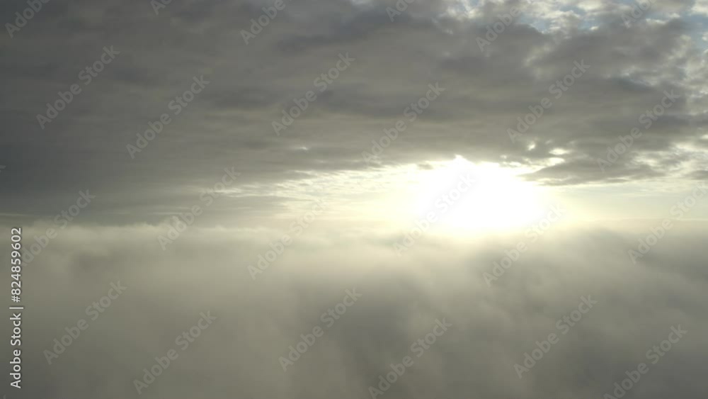 Aerial view of sunrise above clouds, featuring captivating play of light and colors in natural landscape Aerial view of sunrise above clouds, featuring captivating play of light and colors in natural landscape