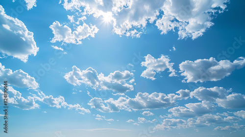 Sunny blue sky with fluffy white clouds. A vibrant image of a clear blue sky filled with fluffy white clouds  perfect for nature and travel themes.