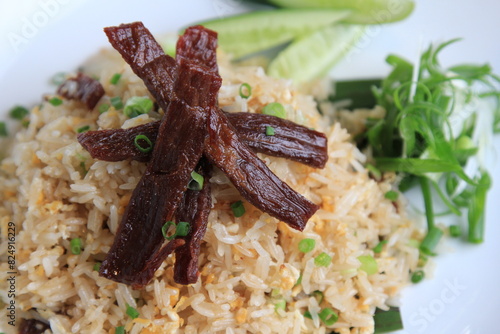 Homemade special Thai Fried Rice with Sun-dried meat, fried with oil, used on medium heat, not cooked until crispy.