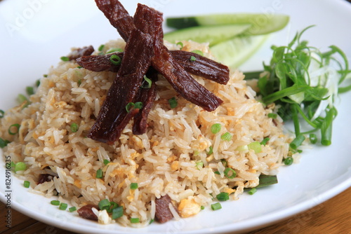 Homemade special Thai Fried Rice with Sun-dried meat, fried with oil, used on medium heat, not cooked until crispy.