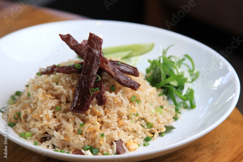 Homemade special Thai Fried Rice with Sun-dried meat, fried with oil, used on medium heat, not cooked until crispy.