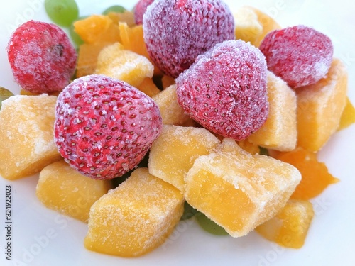 Frozen mango, strawberry and more fruits.